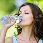 Woman drinking water bottle